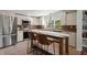 Modern kitchen featuring stainless steel appliances, white cabinets, and breakfast bar at 1616 Refuge Run, Charleston, SC 29412