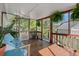 Inviting screened porch with comfortable seating and natural light at 1616 Refuge Run, Charleston, SC 29412