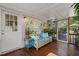Charming screened porch with comfortable seating and decorative plants at 1616 Refuge Run, Charleston, SC 29412