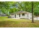 This home has a lovely backyard with mature trees and a lush lawn at 1621 Point Park Dr, Johns Island, SC 29455