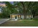 Charming one-story home with a lush green yard and mature trees in a serene, residential setting at 1621 Point Park Dr, Johns Island, SC 29455