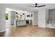 Open-concept living space with a modern kitchen, wood floors, and ample natural light, creating a cozy ambiance at 1621 Point Park Dr, Johns Island, SC 29455