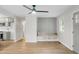 Bright living room with wood floors, a ceiling fan, and a built-in bench, creating a cozy atmosphere at 1621 Point Park Dr, Johns Island, SC 29455