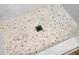 Close-up of mosaic tiled shower floor with drain at 1621 Point Park Dr, Johns Island, SC 29455