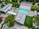 Overhead view of the community pool area with outdoor seating, lounge chairs and green space at 1661 Indy Dr, North Charleston, SC 29405