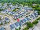 Aerial view of a colorful neighborhood, showcasing the community layout and proximity to green spaces at 1661 Indy Dr, North Charleston, SC 29405