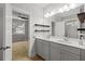 Bright bathroom featuring a double vanity, and an open view to the bedroom, creating an open feel at 1661 Indy Dr, North Charleston, SC 29405