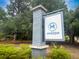 Elegant community entrance sign for Mixson surrounded by lush landscaping and mature trees at 1661 Indy Dr, North Charleston, SC 29405