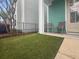 Inviting front porch showcasing an artificial lawn and ample space for outdoor seating with decorative columns at 1661 Indy Dr, North Charleston, SC 29405