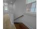 Spacious hallway with plush carpeting and access to a staircase, offering a comfortable transition at 1661 Indy Dr, North Charleston, SC 29405