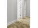 Hallway view showcasing carpet and white doors at 1661 Indy Dr, North Charleston, SC 29405