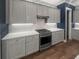 Well-equipped kitchen with stainless steel appliances, white subway tile, and ample cabinet space at 1661 Indy Dr, North Charleston, SC 29405