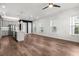 Bright, airy living room seamlessly flows into a modern kitchen with a stylish island and stainless steel appliances at 1661 Indy Dr, North Charleston, SC 29405