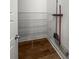 Well-organized pantry with sturdy wire shelving and classic wood-look flooring for efficient storage at 1661 Indy Dr, North Charleston, SC 29405