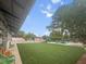 Community pool area with a large grassy play area, lounge chairs, and picnic tables for residents to enjoy at 1661 Indy Dr, North Charleston, SC 29405