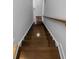 View looking down a staircase featuring rich wood steps and a sturdy handrail for safety at 1661 Indy Dr, North Charleston, SC 29405