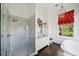 Bright bathroom showcasing marble shower, vanity, ornate mirror, and soaking tub at 172 Tradd St, Charleston, SC 29401