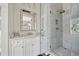 Elegant bathroom featuring a marble vanity, glass shower, and neutral decor at 172 Tradd St, Charleston, SC 29401