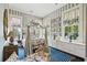 Charming bedroom featuring a canopy bed, striped wallpaper, and built-in cabinets at 172 Tradd St, Charleston, SC 29401