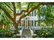 Charming two-story home with classic architectural details and mature trees at 172 Tradd St, Charleston, SC 29401