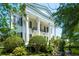 Charming white home with tall columns, creating a classic and sophisticated exterior at 172 Tradd St, Charleston, SC 29401