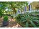 Beautiful home exterior with lush landscaping, brick walkway, and grand staircase at 172 Tradd St, Charleston, SC 29401