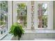 Bright kitchen featuring marble countertops, large windows, and stainless steel fixtures at 172 Tradd St, Charleston, SC 29401