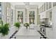 Bright kitchen with expansive marble island, professional-grade range, and abundant natural light at 172 Tradd St, Charleston, SC 29401