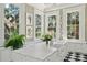 Bright and airy kitchen with a large marble island, lots of counter space, and natural light at 172 Tradd St, Charleston, SC 29401