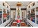 Beautiful library with symmetrical bookshelves and elegant lighting for a distinguished study at 172 Tradd St, Charleston, SC 29401