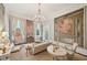 Bright formal living room featuring elegant decor, refined furnishings, and a sparkling chandelier at 172 Tradd St, Charleston, SC 29401