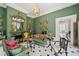 Elegant green living room showcasing classic decor, ornate accents, and stylish furnishings at 172 Tradd St, Charleston, SC 29401