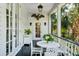 Charming outdoor porch with comfortable seating and well-maintained landscaping, ideal for enjoying the outdoors at 172 Tradd St, Charleston, SC 29401