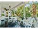 Inviting outdoor porch featuring comfortable seating and lush landscaping, perfect for relaxing and enjoying the outdoors at 172 Tradd St, Charleston, SC 29401