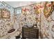 Charming powder room featuring decorative wallpaper, elegant fixtures, and unique design at 172 Tradd St, Charleston, SC 29401