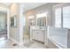 Elegant bathroom featuring a glass-enclosed shower, soaking tub, and marble countertop vanity at 1776 W Canning Dr, Mount Pleasant, SC 29466