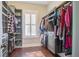 Organized walk-in closet with custom shelving, ample storage space, and a window for natural light at 1776 W Canning Dr, Mount Pleasant, SC 29466