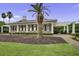 A charming clubhouse with brick facade, white columns, black shutters and a beautifully landscaped yard at 1776 W Canning Dr, Mount Pleasant, SC 29466