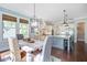 Bright dining area next to the kitchen features a modern light fixture and large windows at 1776 W Canning Dr, Mount Pleasant, SC 29466