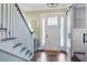 Welcoming entryway with staircase, stylish lighting, and decorative details, creating a warm first impression at 1776 W Canning Dr, Mount Pleasant, SC 29466