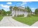 Stately home with a long driveway, well-manicured lawn, and a beautiful exterior, perfect for luxurious living at 1776 W Canning Dr, Mount Pleasant, SC 29466