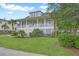 Charming two-story home with a welcoming front porch and beautifully landscaped front yard at 1776 W Canning Dr, Mount Pleasant, SC 29466
