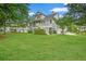 Charming two-story home with a large front lawn, featuring a front porch and well-maintained landscaping at 1776 W Canning Dr, Mount Pleasant, SC 29466