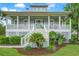 Inviting home exterior with a charming front porch, well-kept lawn, and attractive landscaping enhancing curb appeal at 1776 W Canning Dr, Mount Pleasant, SC 29466