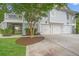 Spacious three-car garage beneath a charming home with a manicured yard and lovely surroundings at 1776 W Canning Dr, Mount Pleasant, SC 29466