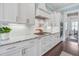 Modern kitchen features white cabinets, granite countertops, and stainless steel appliances at 1776 W Canning Dr, Mount Pleasant, SC 29466