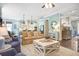 Open-concept living room flowing into the kitchen, featuring modern furnishings and decor at 1776 W Canning Dr, Mount Pleasant, SC 29466