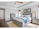 Serene primary bedroom featuring a tray ceiling, neutral decor, and well-placed windows at 1776 W Canning Dr, Mount Pleasant, SC 29466