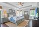 Comfortable primary bedroom with a tray ceiling, neutral decor, and ample natural light at 1776 W Canning Dr, Mount Pleasant, SC 29466