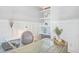Close-up on a home office setup with desk, decor, and built-in white shelving at 1776 W Canning Dr, Mount Pleasant, SC 29466